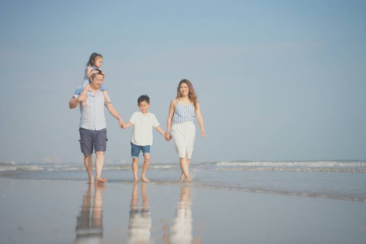 Family walking along the beach