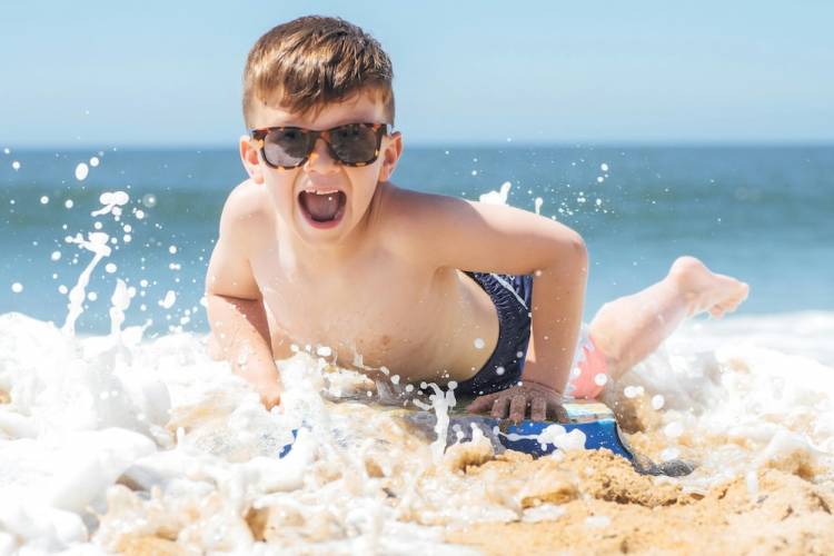 Kid having fun in the sand