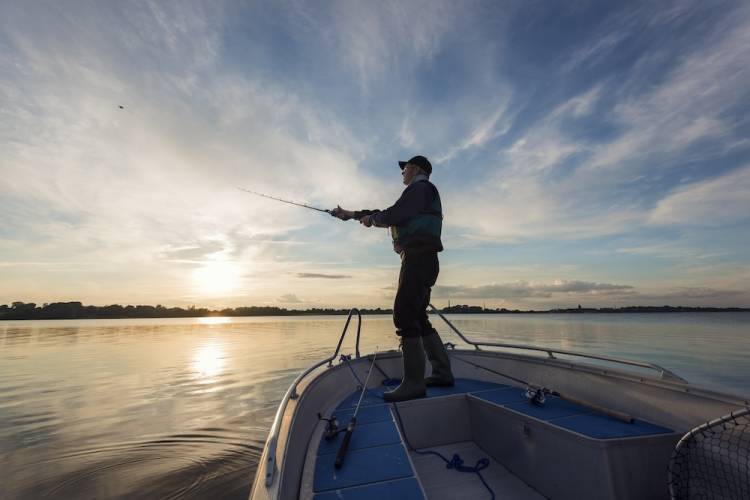 Man fishing on boat during a fishing tournament