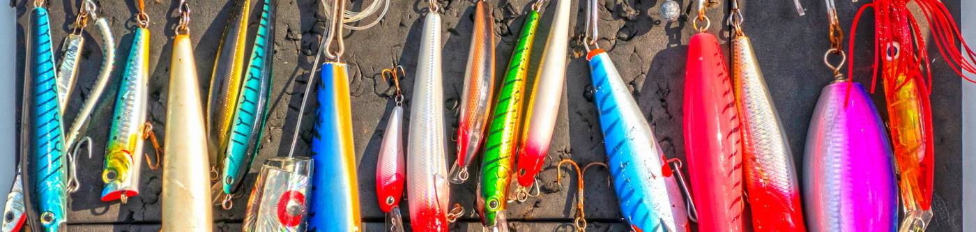 various brightly colored fishing lures and hooks