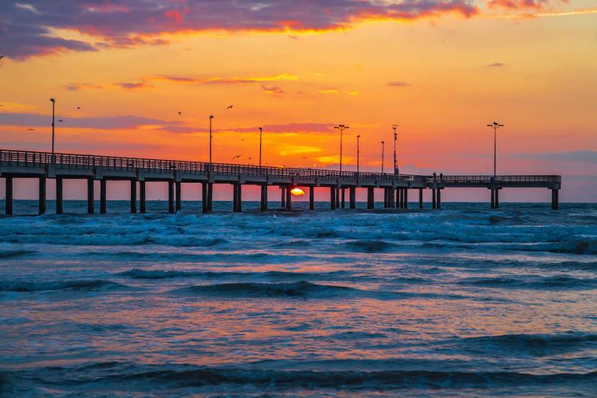 Long fishing pier in Port Aransas at sunset