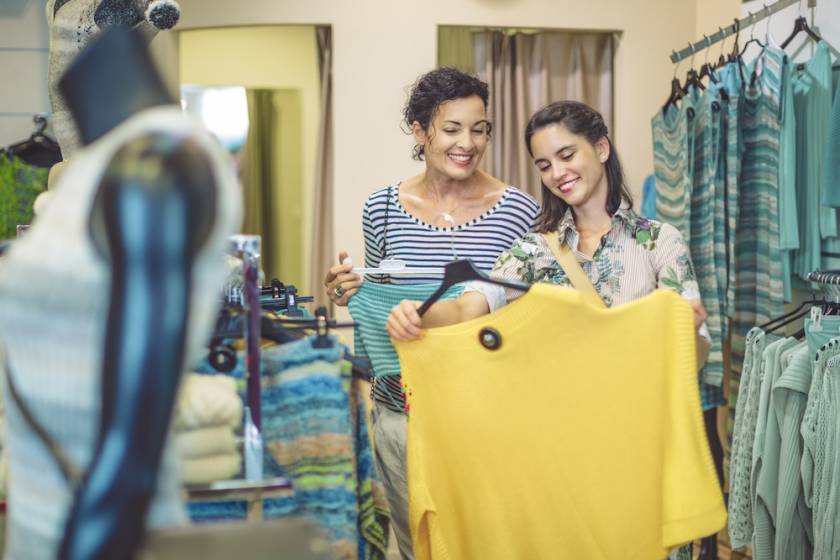 Mother and adult daughter shopping at a local boutique